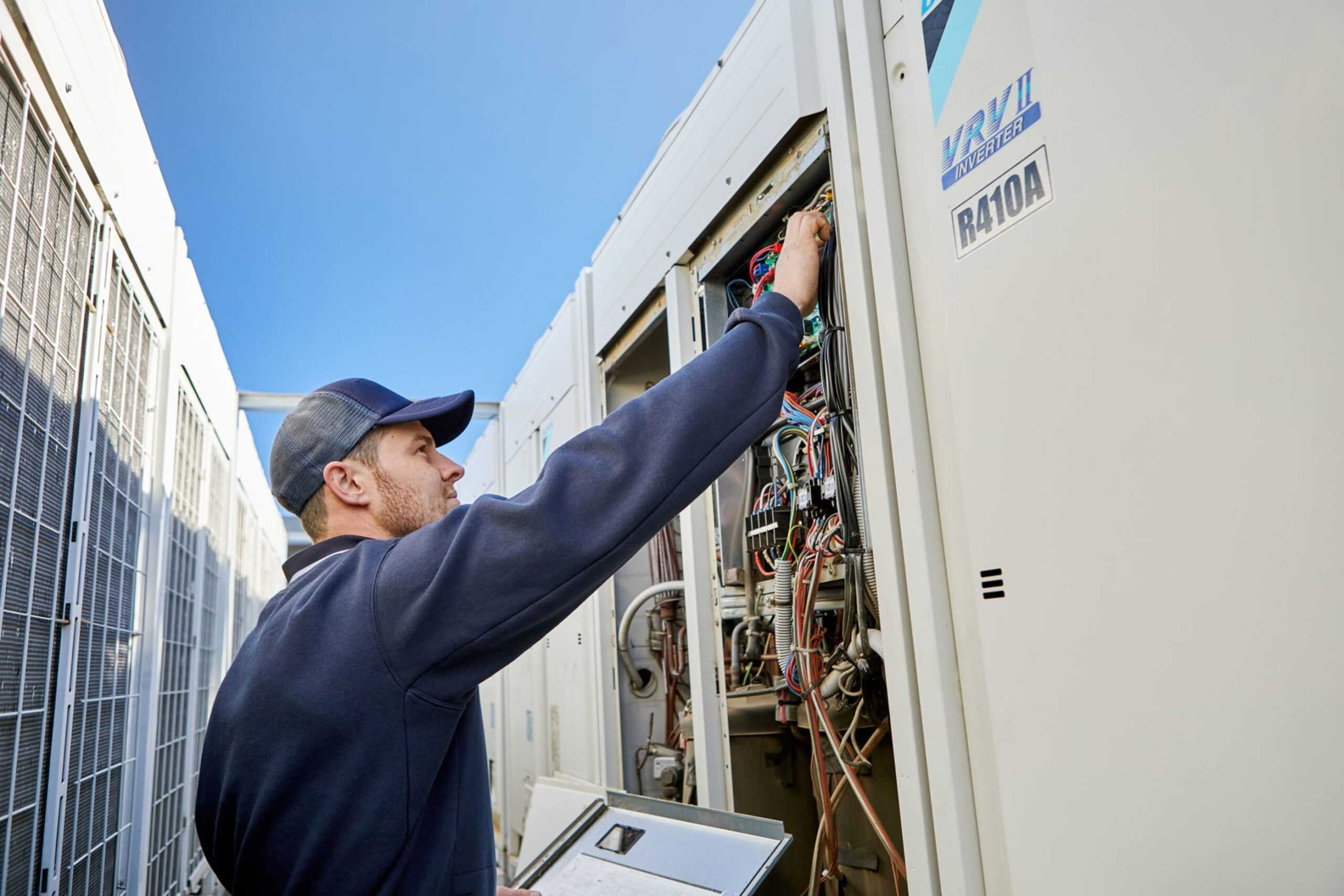 A Tonkin Group employee servicing commercial refrigeration.