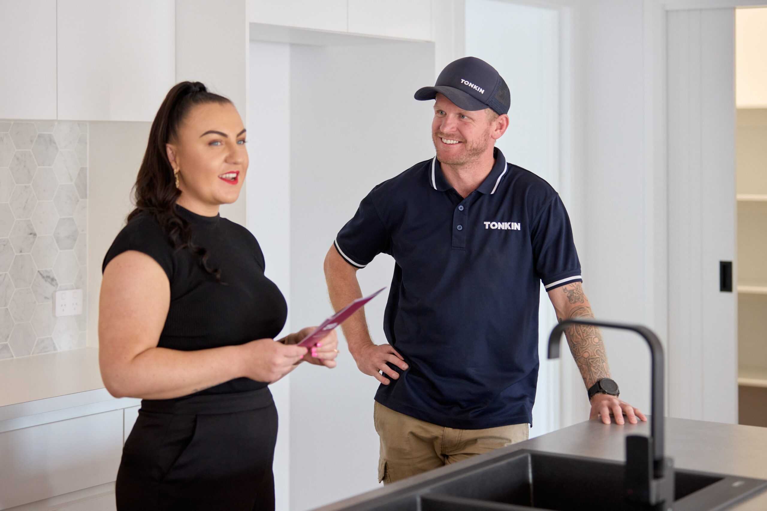 A Tonkin Group employee with a property services manager.