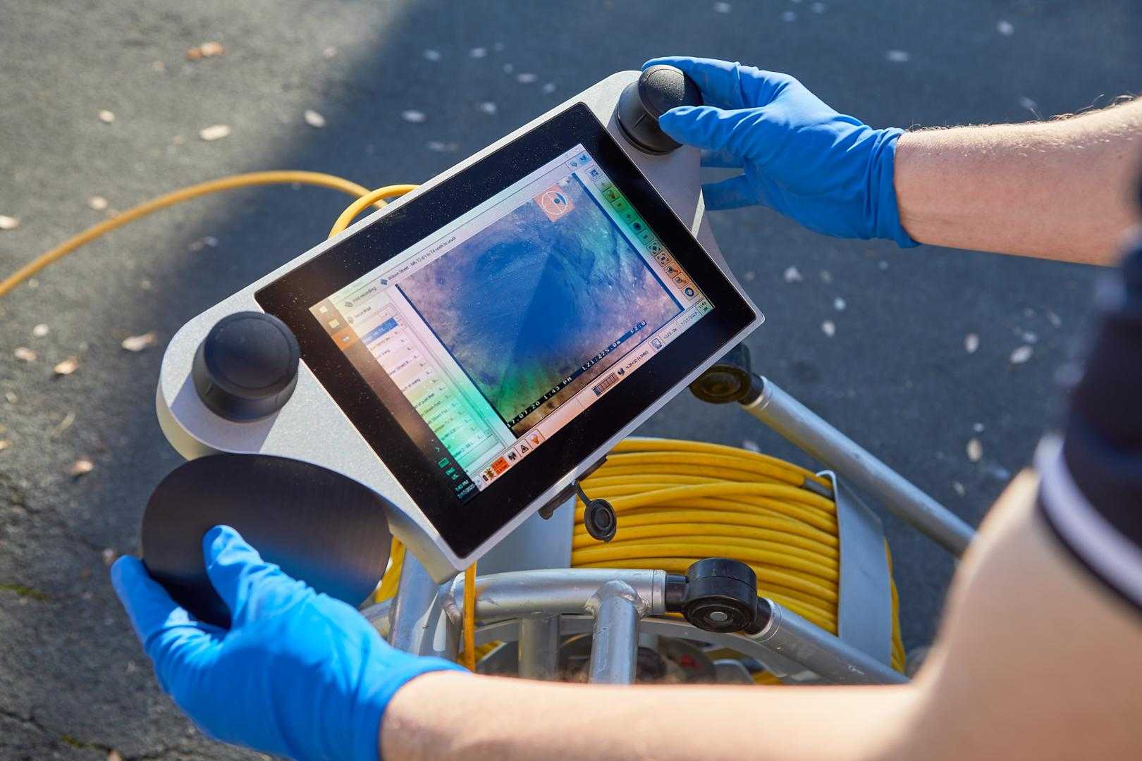 A Tonkin Group employee using commercial pipe mapping relining software.