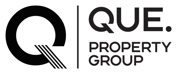 The QUE Property Group logo.